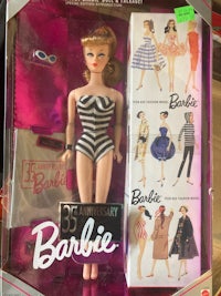 a barbie doll in a box