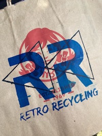 a paper bag with the words retro recycling on it