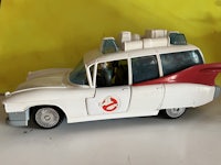 a toy ghostbus car is shown on a table
